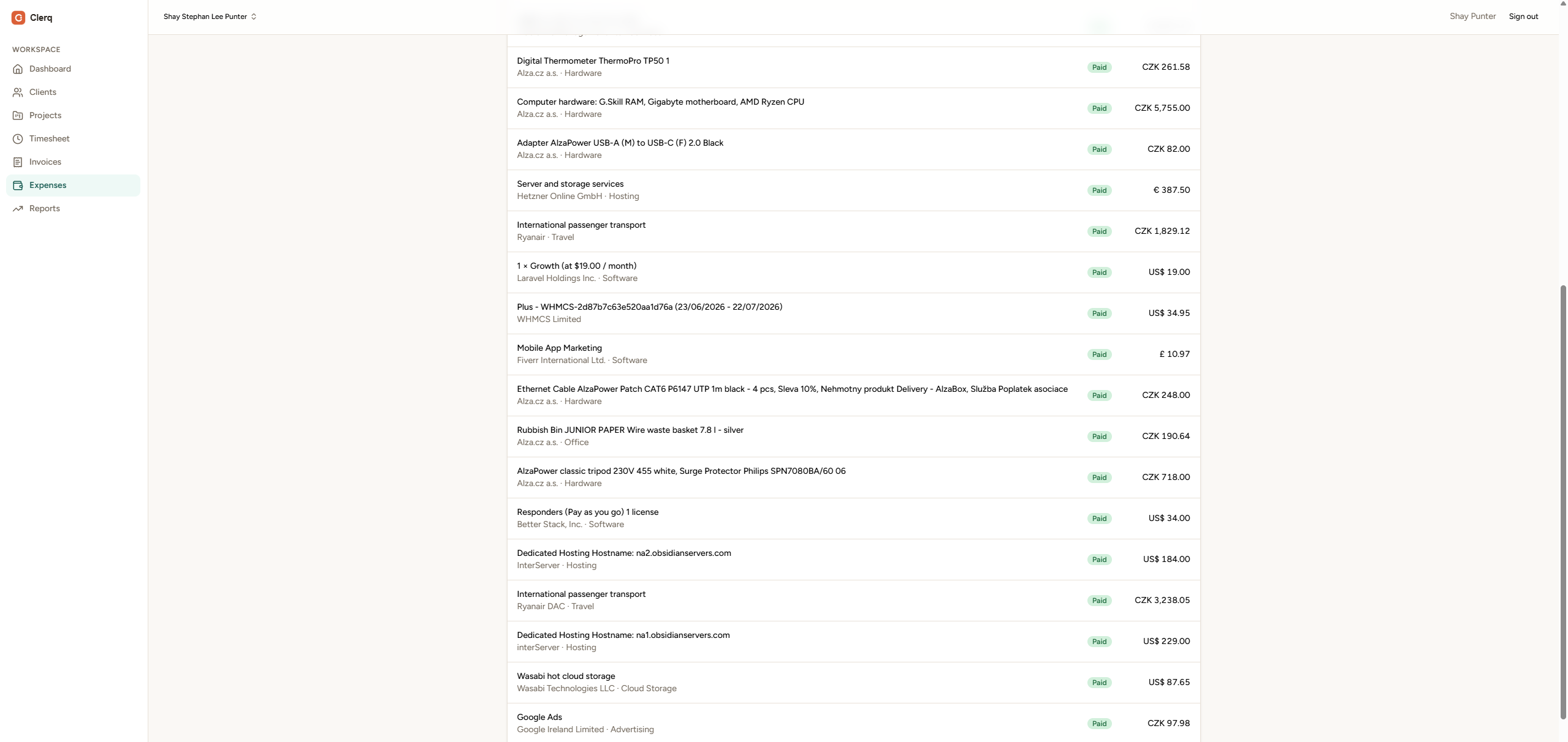 Clerq expenses list showing paid expenses with vendor, category and multi-currency amounts